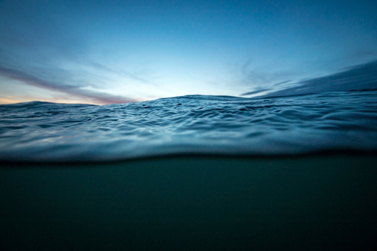 Capture of calm ocean waves during sunset in La Pampa, Argentina. Tranquil seascape with vivid sky.